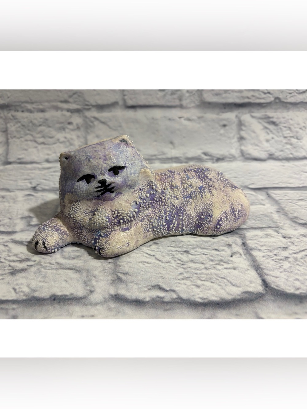 Vintage hand-painted textured ceramic resting cat decor